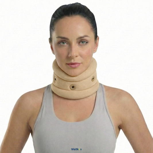 Woman wearing a beige neck brace against a white background